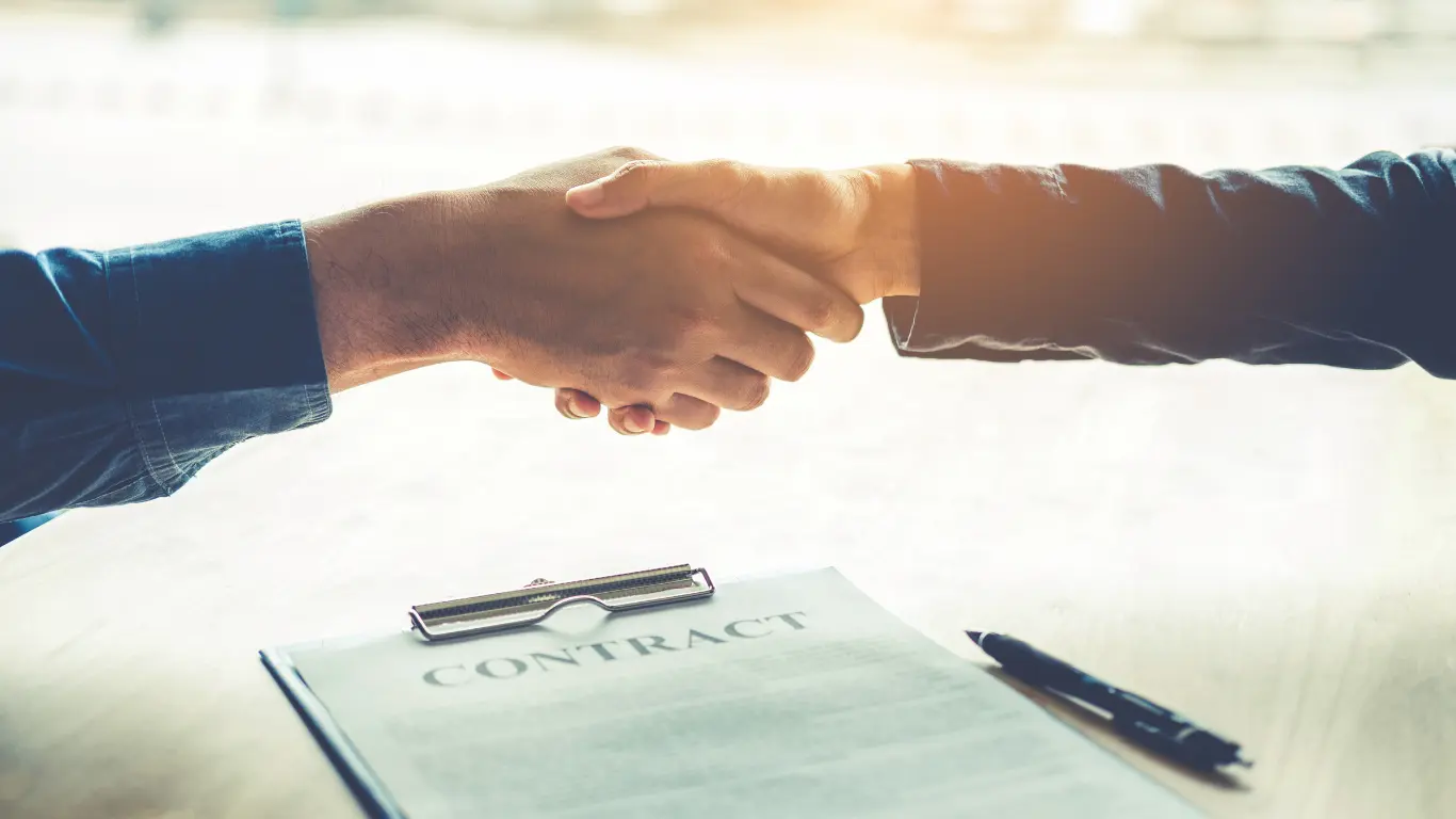 florida escrow, title, and legal services attorney shaking hands